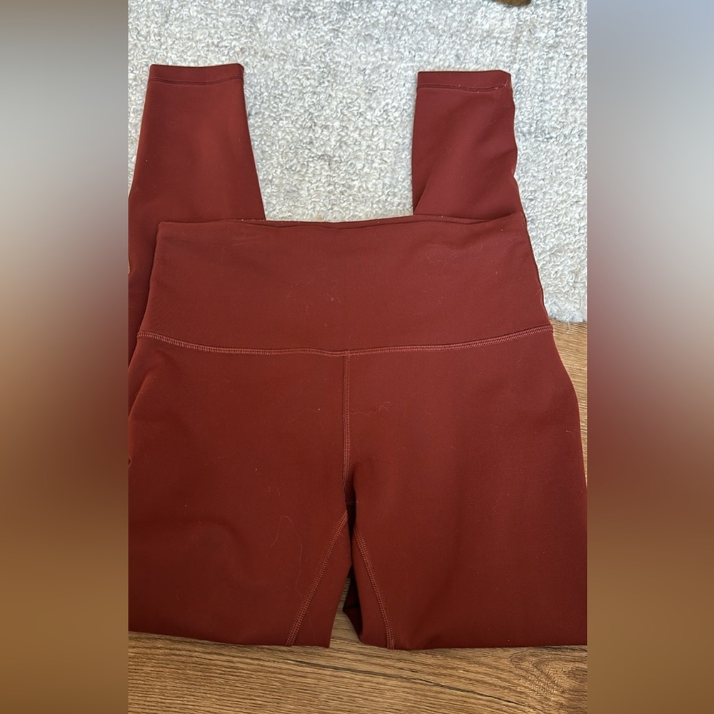 Lululemon size 8 leggings EUC full length color is a brick reddish brown